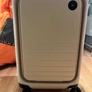 Cream Rolling Suitcase from Monos